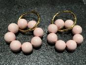 Boucles d'oreilles créoles avec perles roses 